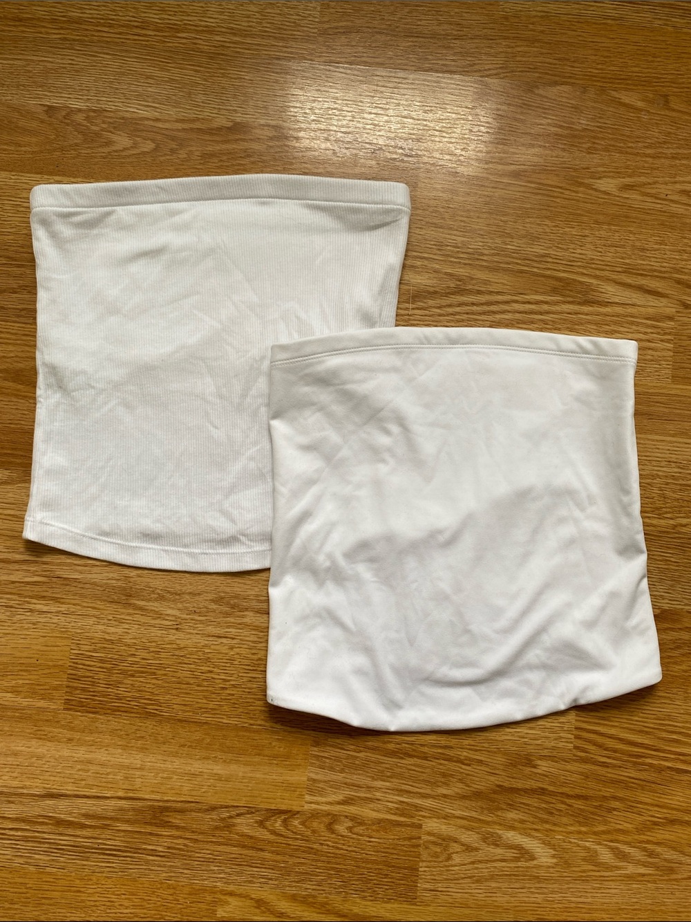 Two white tube tops